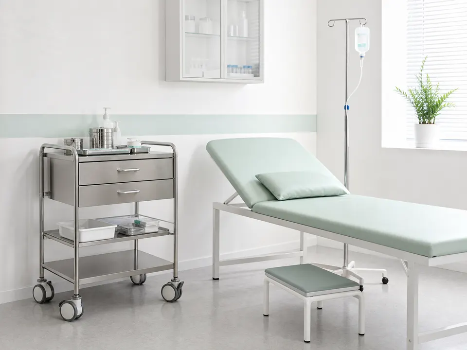 Examination couch, instrument trolley and IV stand